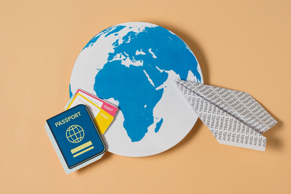 illustration of globe, paper plane, and passport representing a world with no visas