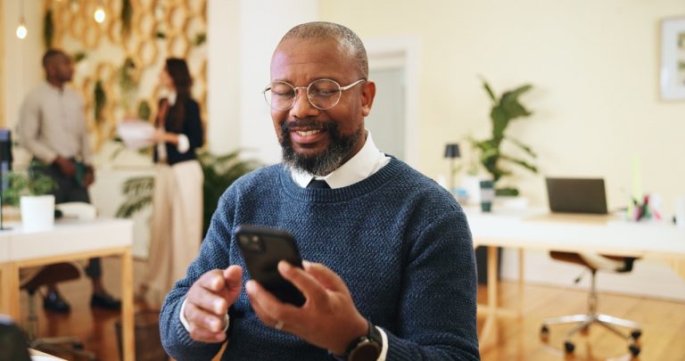 man reading emails on phone
