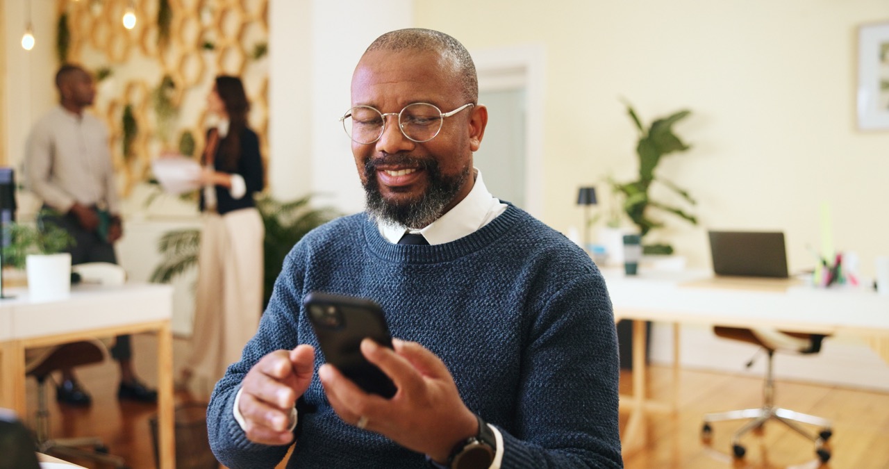man reading emails on phone